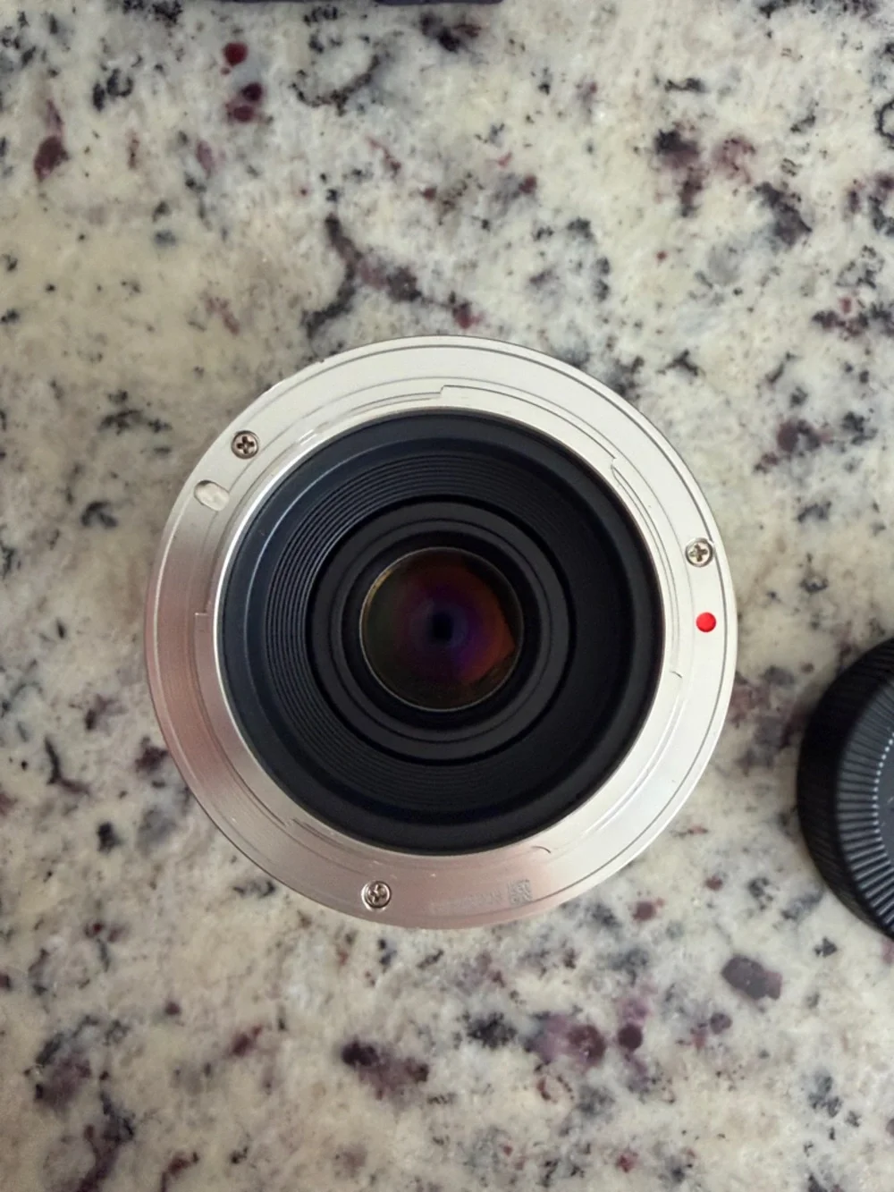 Rokinon 12mm F2 manual focus lens, with hood, and Drawstring Pouch. Sony E mount